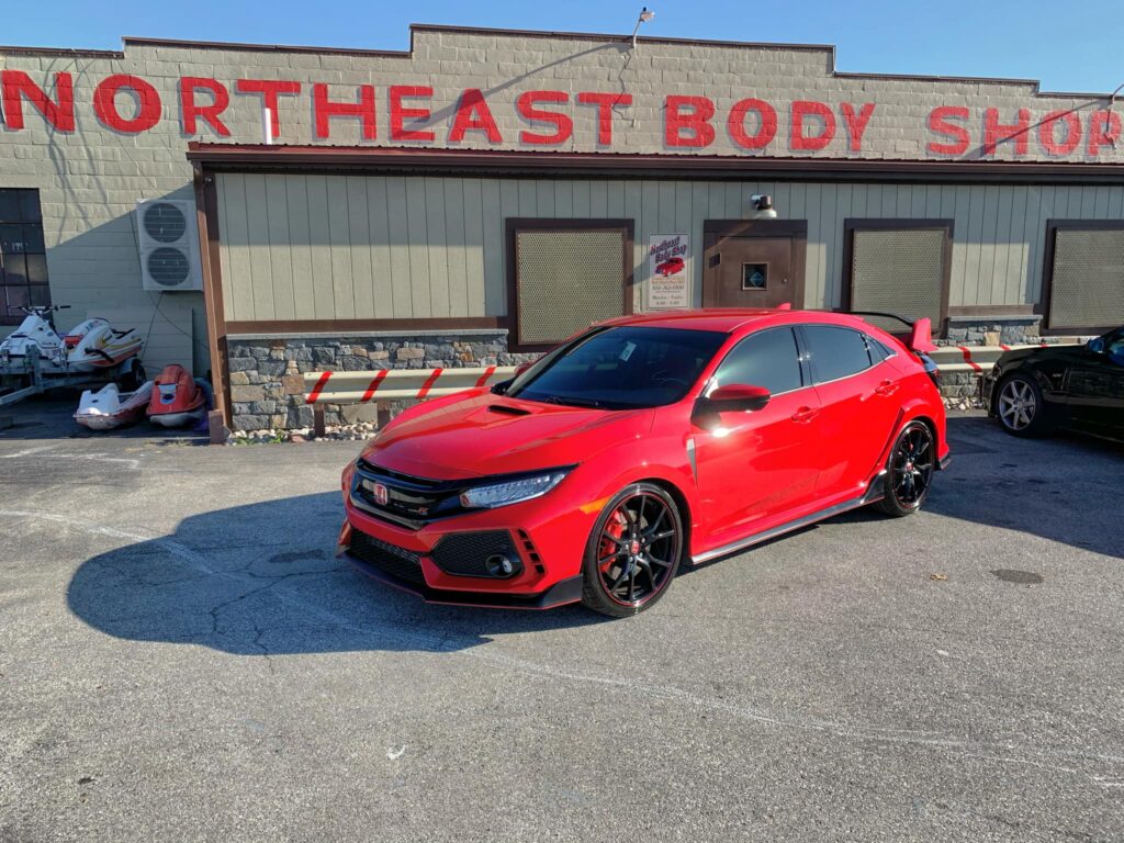 north east auto body shop red honda sedan